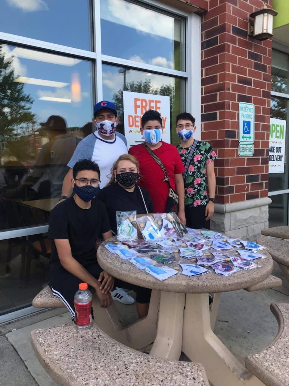 La Chapina De Chicago team doing community outreach with promotional materials